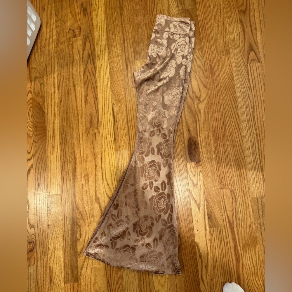 Flare rose gold pants. Shorts under. Sheer pants
